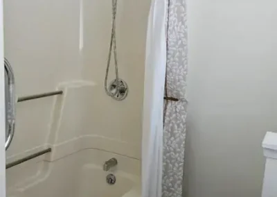 Large, bright and clean bathroom with shower